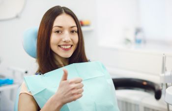 Happy patient with thumb up