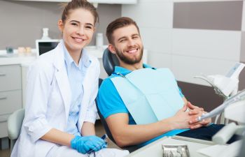 Happy patient with a dentist