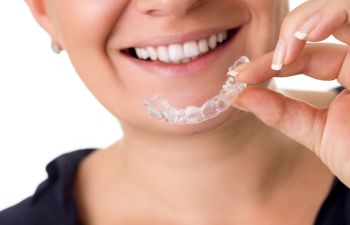 Woman holding invisalign