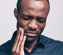 a black man with toothache