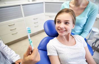 Pediatric Patient Sitting in Dentist Chair Roswell, GA