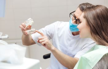 Dentist and Patient Consulting About Dental Implants Roswell GA