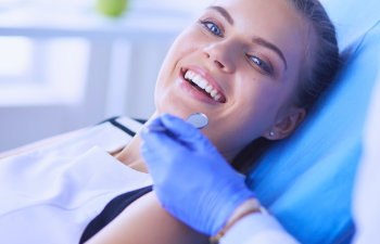 woman happy in the dentist chair, 